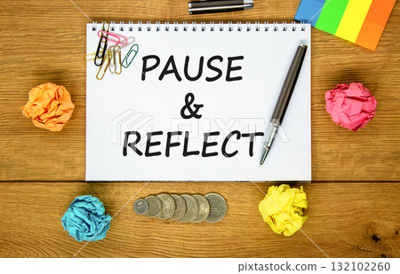 Pause and reflect symbol. Concept words Pause and reflect on beautiful white note. Colored paper. Beautiful wooden background. Business motivational lifestyle pause and reflect concept. Copy space. 132102260