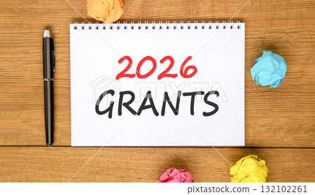 2026 Grants symbol. Concept words 2026 Grants on beautiful white note. Beautiful wooden background. Black pen. Colored paper. Business and 2026 grants concept. Copy space. 132102261