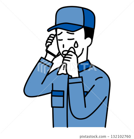 一名身穿工作服的男子一邊打電話一邊哭泣 132102760