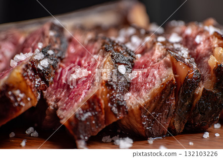 Sliced Medium Rare Steak with Coarse Salt 132103226