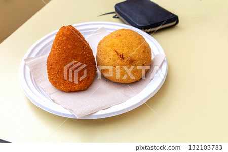 Traditional italian arancini rice balls on plate Traditional italian arancini rice balls on plate 132103783
