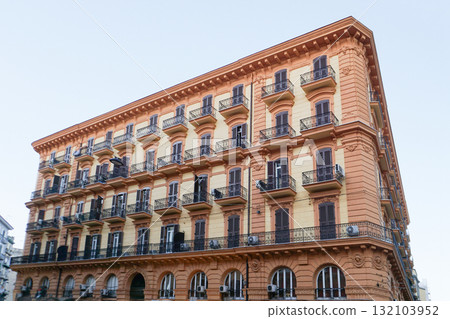 Naples, Italy - Colorful facades in a narrow street in old town of historic italian metropole Naples. Balconys of typical residential buildings at Naples, Italy 132103952