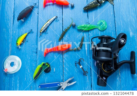 Fishing reel, fishing line, pliers. Fishing lures. Fishing reel, fishing line, pliers. Fishing lures. 132104478