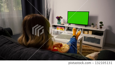 Woman Watching Green Chroma Key Screen TV, Relaxing. 132105131