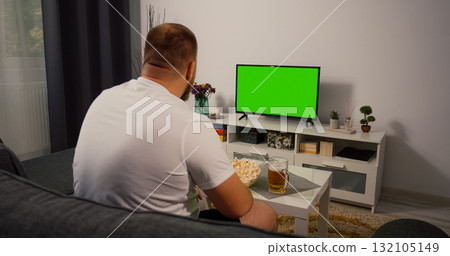 Man watches Green Screen Chroma Key Screen. 132105149