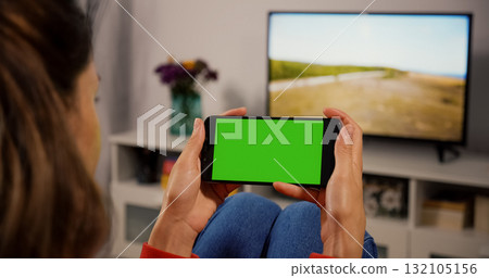 Woman Using Smartphone with Green Screen for Copy Space Mockup Woman Using Smartphone with Green Screen for Copy Space Mockup 132105156