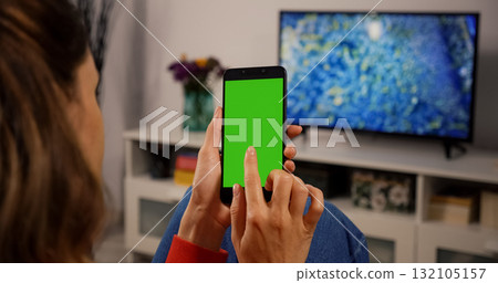 Woman Using Smartphone with Green Screen for Copy Space Chroma Key Mock Up 132105157