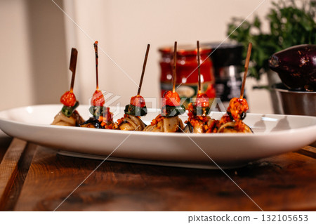 Fried Eggplant with Peppers, tomatoes and Appetizing Fried Beef Meatballs. 132105653