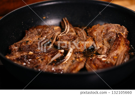 Lamb Cooking. Delicious Meat dish. Lamb Cooking. Delicious Meat dish. 132105660
