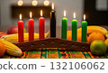 Kwanzaa celebration with kinara candles and fresh fruit arrangement Kwanzaa celebration with kinara candles and fresh fruit arrangement 132106062