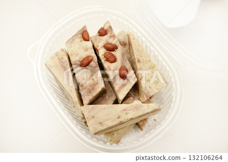 Oriental sweetness. Sweet sherbet with peanuts. Walnut sorbet is a milk lipstick with walnuts and candied fruits. 132106264