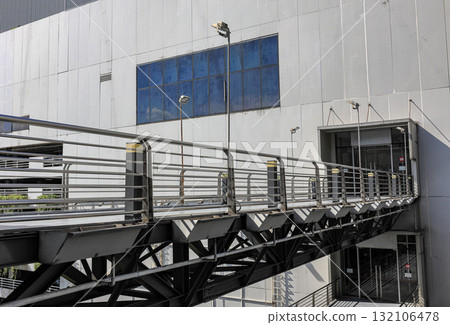 Pedestrian pathway or corridor or hallway between building. 132106478