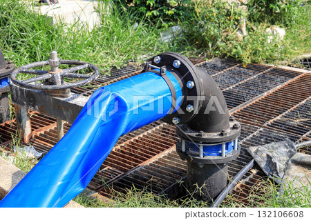 Dewatering pump with connected pipes and hoses of flood management system. Dewatering pump with connected pipes and hoses of flood management system. 132106608