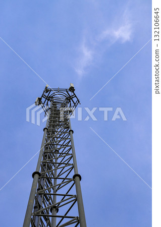 Wireless Communication Antenna pole, Mobile phone mast antenna pole on top of dilapidated building. Wireless Communication Antenna pole, Mobile phone mast antenna pole on top of dilapidated building. 132106645