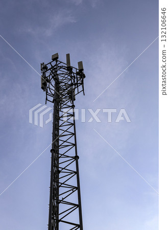 Wireless Communication Antenna pole, Mobile phone mast antenna pole on top of dilapidated building. 132106646