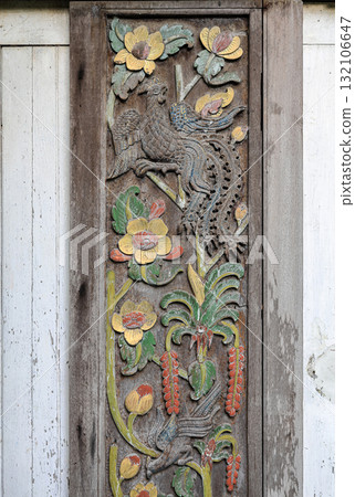 Close up old Carving wooden door with color sculptural, wood carving Door. Close up old Carving wooden door with color sculptural, wood carving Door. 132106647
