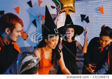 Joyful office Halloween party with coworkers in costumes, celebrating with drinks and laughter, fostering teamwork and festive spirit Joyful office Halloween party with coworkers in costumes, celebrating with drinks and laughter, fostering teamwork and festive spirit 132106672