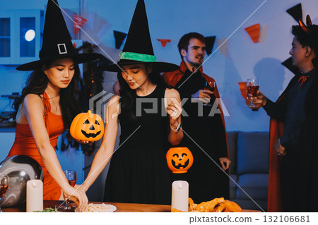 Joyful office Halloween party with coworkers in costumes, celebrating with drinks and laughter, fostering teamwork and festive spirit Joyful office Halloween party with coworkers in costumes, celebrating with drinks and laughter, fostering teamwork and festive spirit 132106681