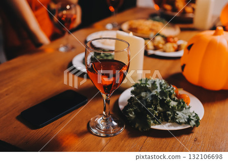 Joyful office Halloween party with coworkers in costumes, celebrating with drinks and laughter, fostering teamwork and festive spirit Joyful office Halloween party with coworkers in costumes, celebrating with drinks and laughter, fostering teamwork and festive spirit 132106698