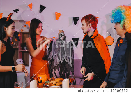 Joyful office Halloween party with coworkers in costumes, celebrating with drinks and laughter, fostering teamwork and festive spirit Joyful office Halloween party with coworkers in costumes, celebrating with drinks and laughter, fostering teamwork and festive spirit 132106712