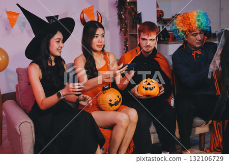 Joyful office Halloween party with coworkers in costumes, celebrating with drinks and laughter, fostering teamwork and festive spirit Joyful office Halloween party with coworkers in costumes, celebrating with drinks and laughter, fostering teamwork and festive spirit 132106729