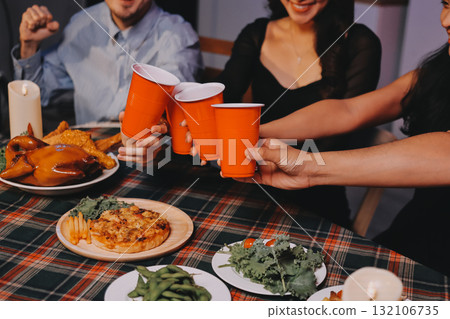 Diversity, dinner and group of people toast celebration together at party. Friends, happy and celebrate with food, wine and friendship for love, support and cheers champagne at business function Diversity, dinner and group of people toast celebration together at party. Friends, happy and celebrate with food, wine and friendship for love, support and cheers champagne at business function 132106735