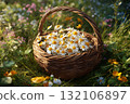 Wicker Basket Full of Daisies Resting in a Sunny Meadow 132106897