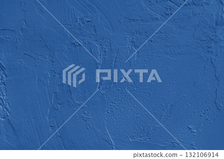 Close up blue colored painted plaster wall surface background with rough brushstrokes texture Close up blue colored painted plaster wall surface background with rough brushstrokes texture 132106914
