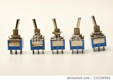 Small electric switches. Electric toggle switch. Blue switches. 132106993