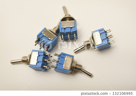 Small electric switches. Electric toggle switch. Blue switches. Small electric switches. Electric toggle switch. Blue switches. 132106995