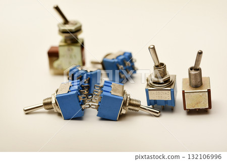 Small electric switches. Electric toggle switch. Blue switches. 132106996