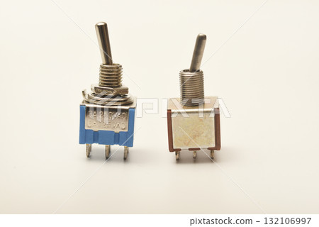 Small electric switches. Electric toggle switch. Blue switches. 132106997