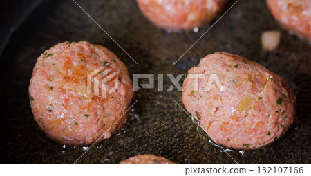 Tasty Meatballs Frying on Hot Pan Close Up Tasty Meatballs Frying on Hot Pan Close Up 132107166