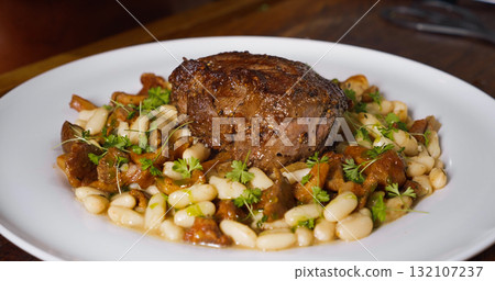 Professional chef cooking in kitchen. 132107237