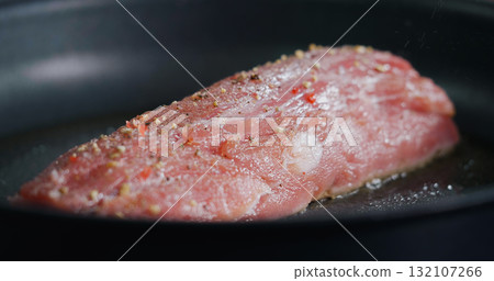 Raw Pork Meat Seasoned is Frying in Hot Pan. 132107266
