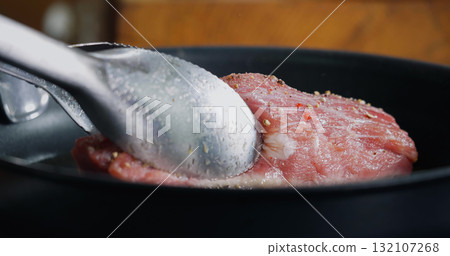 Pork Meat Seasoned is Frying in Hot Pan. 132107268