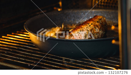 Pork Meat put in oven for cooking. Food and health concept. Pork Meat put in oven for cooking. Food and health concept. 132107276