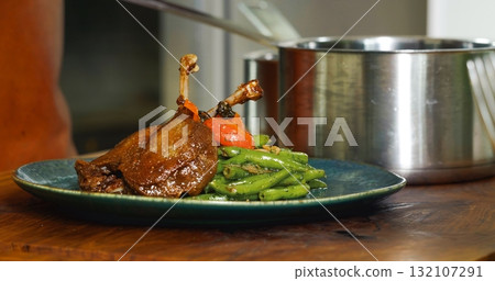 Appetizing Duck Meal Fried Tomato Decorated Close Up Details of Cooking. 132107291