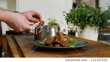 Appetizing Duck Meal Fried Tomato Decorated Close Up Details of Cooking. Appetizing Duck Meal Fried Tomato Decorated Close Up Details of Cooking. 132107293