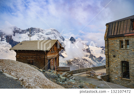 Mountain Huts at Gornergrat with Snowy Swiss Alps in Switzerland 132107472
