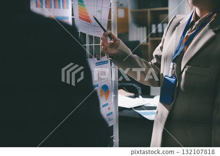 Close up high angle Asian businesswoman working with her coworker in meeting room 132107818
