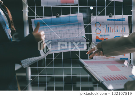 Close up high angle Asian businesswoman working with her coworker in meeting room Close up high angle Asian businesswoman working with her coworker in meeting room 132107819