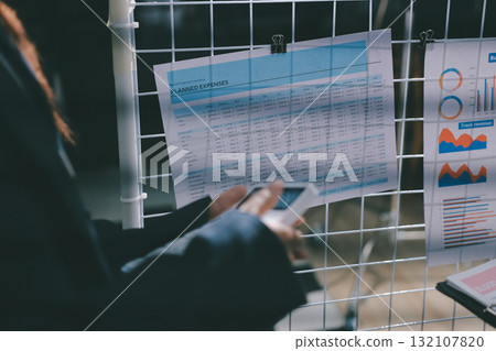 Close up high angle Asian businesswoman working with her coworker in meeting room Close up high angle Asian businesswoman working with her coworker in meeting room 132107820
