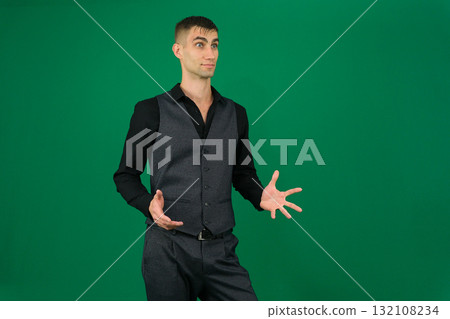 Set of videos with handsome European businessman in classic suit vest and black shirt showing different emotions gestures and confident poses on green chroma key background with copy space 132108234