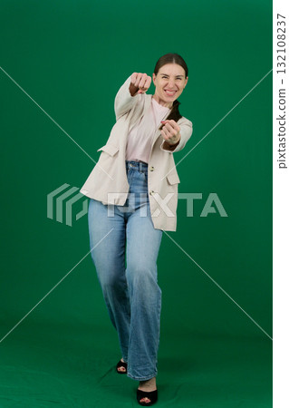 Set of photos of young European woman in light blazer and blue jeans showing various emotions gestures and expressions on green chroma key background with copy space for advertising and social media Set of photos of young European woman in light blazer and blue jeans showing various emotions gestures and expressions on green chroma key background with copy space for advertising and social media 132108237