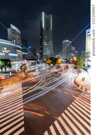 Yokohama Landmark Tower and the light trails of cars passing through the intersection Yokohama Landmark Tower and the light trails of cars passing through the intersection 132109067