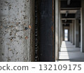 A rough-textured concrete column and a dark, raw steel I-beam. 132109175