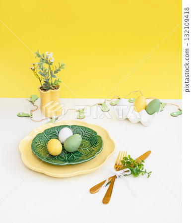 Easter celebration concept. Top view vertical green yellow plate eggs, isolated background, banner Easter celebration concept. Top view vertical green yellow plate eggs, isolated background, banner 132109418