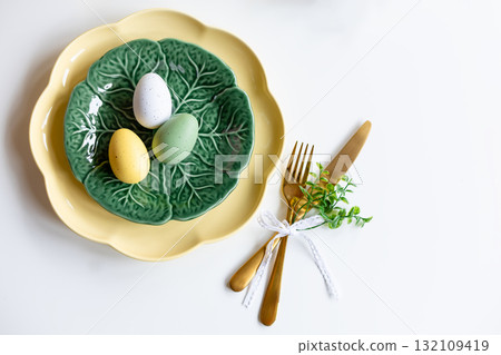 Easter celebration concept. Top view vertical green yellow plate eggs, isolated background, banner Easter celebration concept. Top view vertical green yellow plate eggs, isolated background, banner 132109419