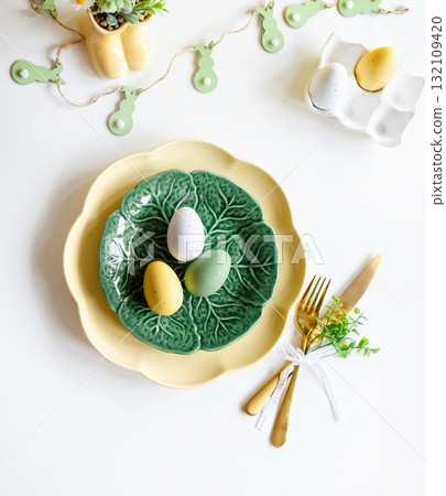 Easter celebration concept. Top view vertical green yellow plate eggs, isolated background, banner Easter celebration concept. Top view vertical green yellow plate eggs, isolated background, banner 132109420